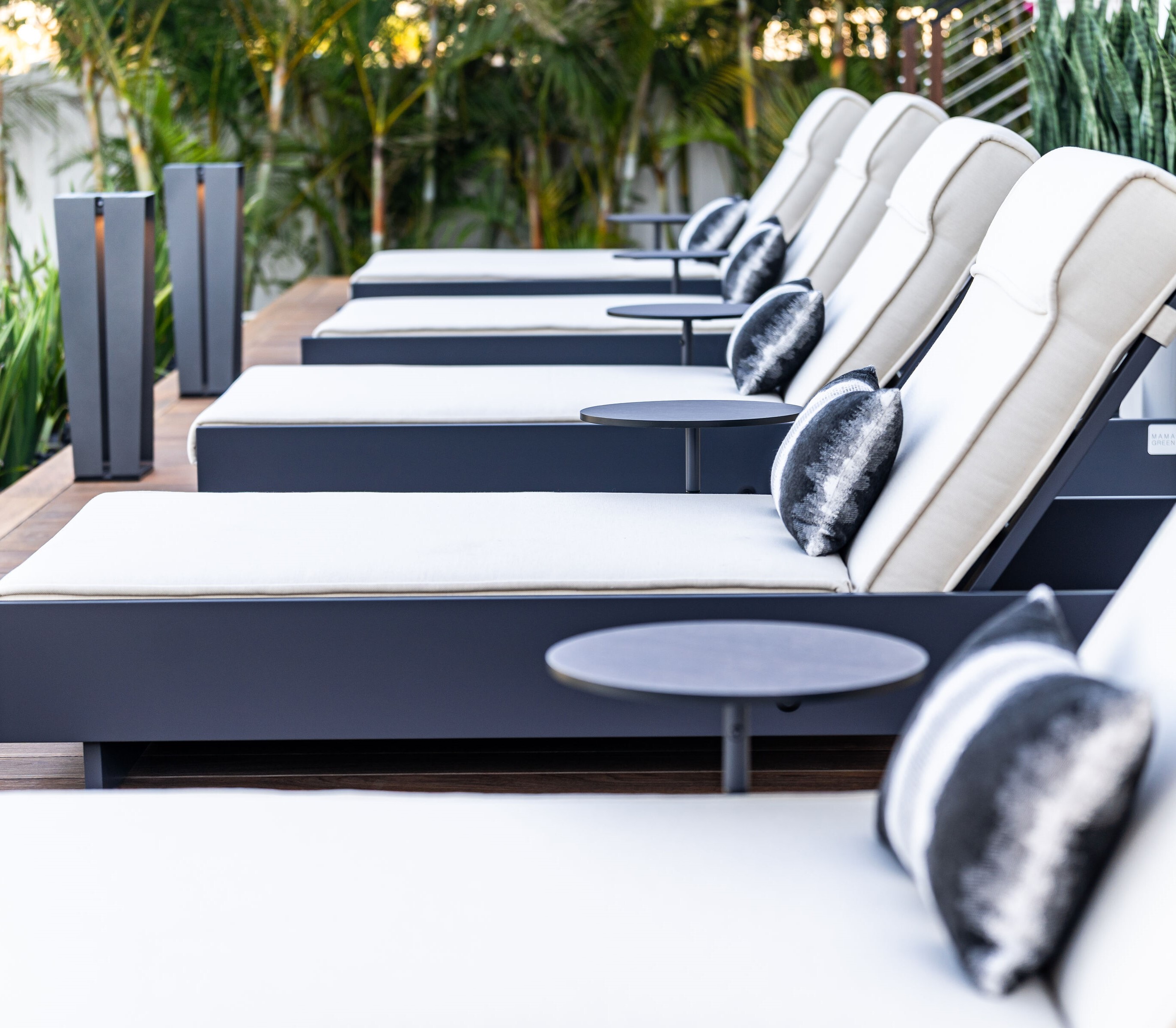 MAMAGREEN lounge chairs line the deck on a Tampa Bay home.