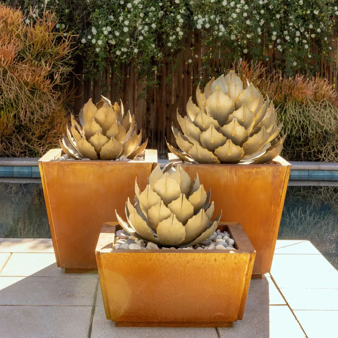 metal-artichoke-agave-sculptures-in-orange-planters